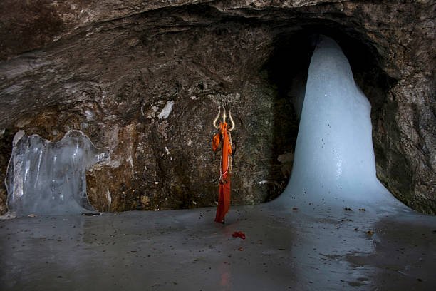BALTAL, INDIA - JUNE 29: An ice stalagmite, a stylized phallus worshiped by Hindus as a symbol of the god Shiva, is seen during Amarnath pilgrimage one of the most revered of Hindu shrines, on June 29, 2011 near Baltal, Jammu and Kashmir, India. More than 5,000 Hindu devotees, braving sub-zero temperatures, began the hike over glaciers and along paths overhanging gorges to reach the sacred Amarnath cave housing an ice stalagmite, a stylized phallus worshiped by Hindus as a symbol of the god Shiva, enveloped by the rugged Himalayan mountains. The Kashmiri mountains near Srinagar are 3,800 metres above sea level and are home to an ice stalagmite resembling the Hindu god Shiva. About 200,000 Hindu pilgrims are expected to take part in this year's two-month pilgrimage, during which large numbers of Indian paramilitary soldiers and policemen are being deployed along the route as protection from attacks by militants who have been fighting for independence of Kashmir since 1989.  (Photo by Yawar Nazir/Getty Images)